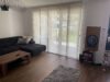 Moderne Erdgeschosswohnung mit schönem Garten zu vermieten - Wohnzimmer