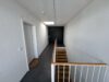 Exklusives Penthouse – Nachhaltiger Wohnluxus mit Alpenblick, Sauna und großzügigen Sonnenterrassen - Treppenhaus