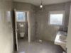 Repräsentative Villa mit außergewöhnlicher Architektur, Einliegerwohnung & 4 Garagenplätzen - EG Badezimmer