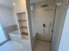Exklusives Penthouse – Nachhaltiger Wohnluxus mit Alpenblick, Sauna und großzügigen Sonnenterrassen - Badezimmer