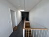 Exklusives Penthouse – Nachhaltiger Wohnluxus mit Alpenblick, Sauna und großzügigen Sonnenterrassen - Treppenhaus